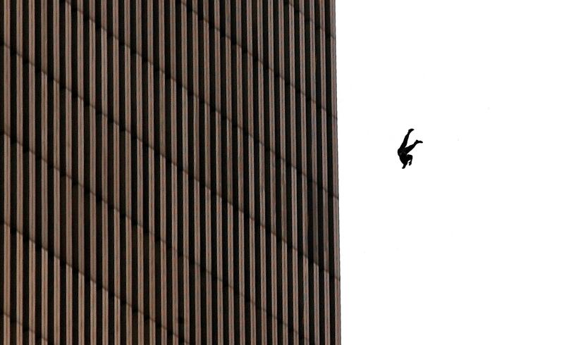 A man falls to his death from the World Trade Center after two planes hit the twin towers September 11, 2001 in New York City in an terrorist attack.