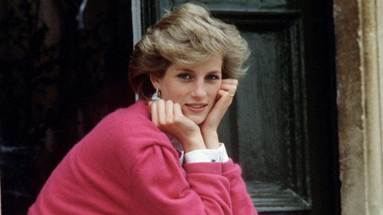 Princess Diana sitting on a front step at her house in 1986.