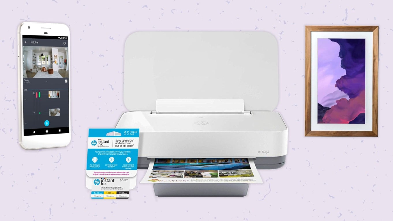 An array of tech products that includes a phone and printer.