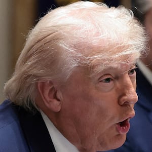 U.S. President Donald Trump holds a Sharpie pen that was custom-made for the White House, during a cabinet meeting at the White House in Washington, D.C., U.S., March 26, 2026. REUTERS/Evelyn Hockstein