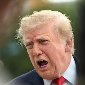 US President Donald Trump speaks to members of the press before boarding Marine One as he departs from the South Lawn of the White House in Washington, DC, on September 26, 2026. US President Donald Trump is heading to Knoxville, Tennessee to attend the Tennessee/Texas college football game.