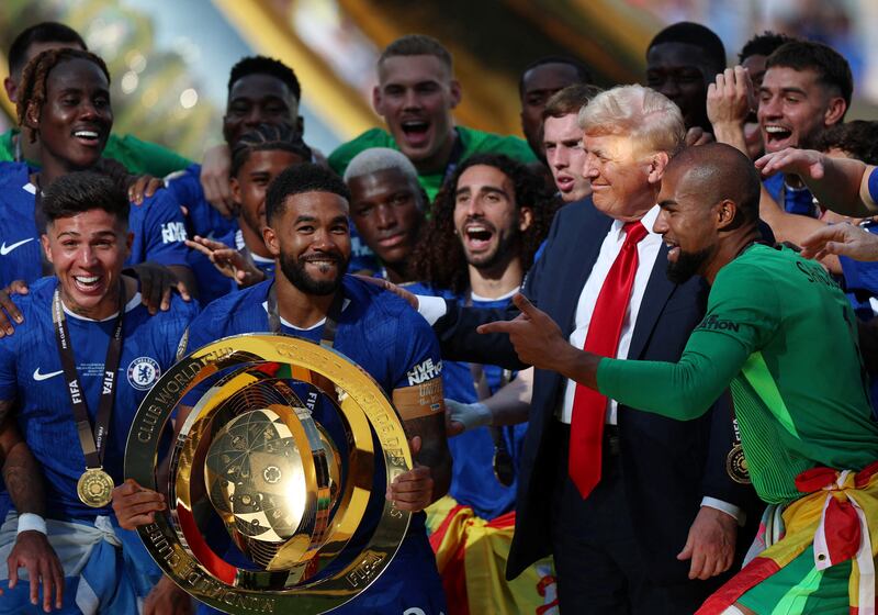 Soccer Football - FIFA Club World Cup - Final - Chelsea v Paris St Germain - MetLife Stadium, East Rutherford, New Jersey, U.S. - July 13, 2025 Chelsea's Reece James and teammates celebrate with the trophy alongside U.S. President Donald Trump after winning the FIFA Club World Cup REUTERS/Hannah Mckay/File Photo