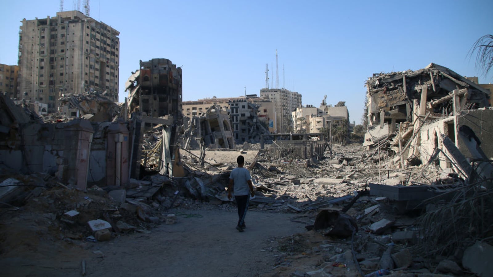 Palestinian citizens inspect damage to their homes caused by Israeli airstrikes on Oct. 13, 2023, in Gaza City, Gaza.