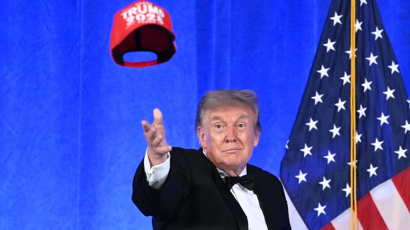 Donald Trump throws his "Trump 2028" hat into an unappreciative audience at this year's 2026 White House Correspondents' Association Dinner.