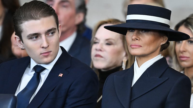 Barron Trump and first lady Melania Trump listen as President Donald Trump gives his inaugural address in the U.S. Capitol Rotunda on January 20, 2025 in Washington, DC.