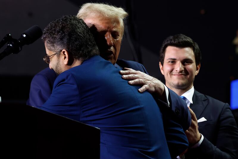 GRAND RAPIDS, MICHIGAN - NOVEMBER 05: Republican presidential nominee, former U.S. President Donald Trump, embraces Hamtramck, Michigan, Mayor Amer Ghalib during Trump's final campaign rally of the election year at Van Andel Arena on November 05, 2024 in Grand Rapids, Michigan. Trump campaigned for re-election in the battleground states of North Carolina and Pennsylvania before arriving for his last rally minutes after midnight in Michigan. (Photo by Chip Somodevilla/Getty Images)