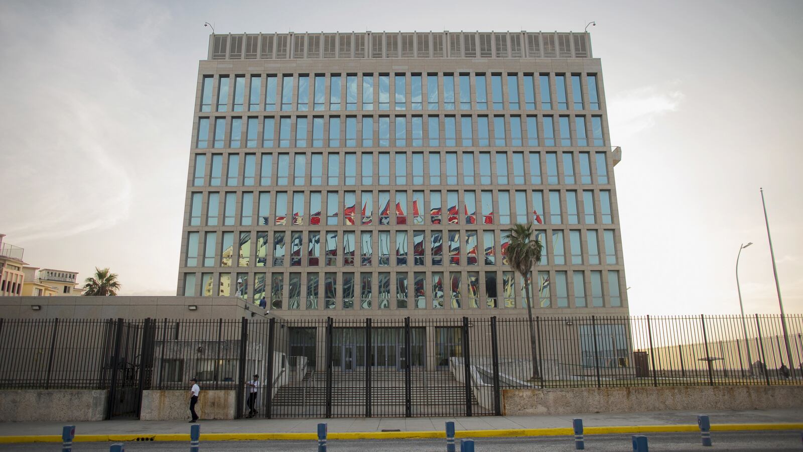 Cuban flags are reflected at the U.S Embassy in Havana, July 27, 2015.