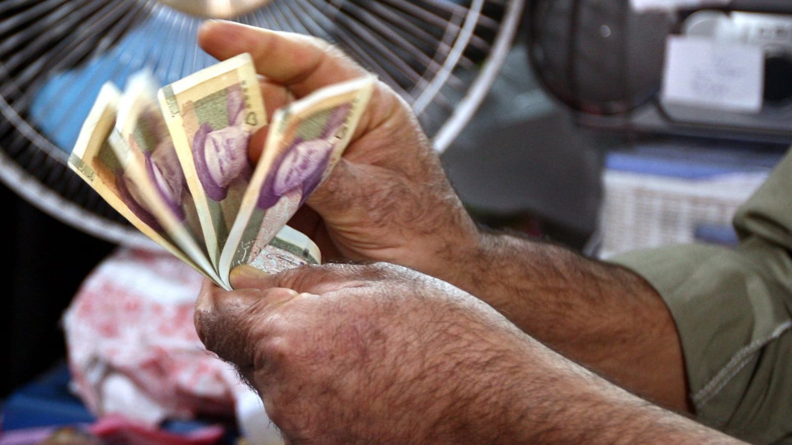 articles/2012/10/04/iran-s-currency-crisis-bad-news-for-mahmoud-ahmadinejad/iran-money-rial-memarian-tease_ylvwgt