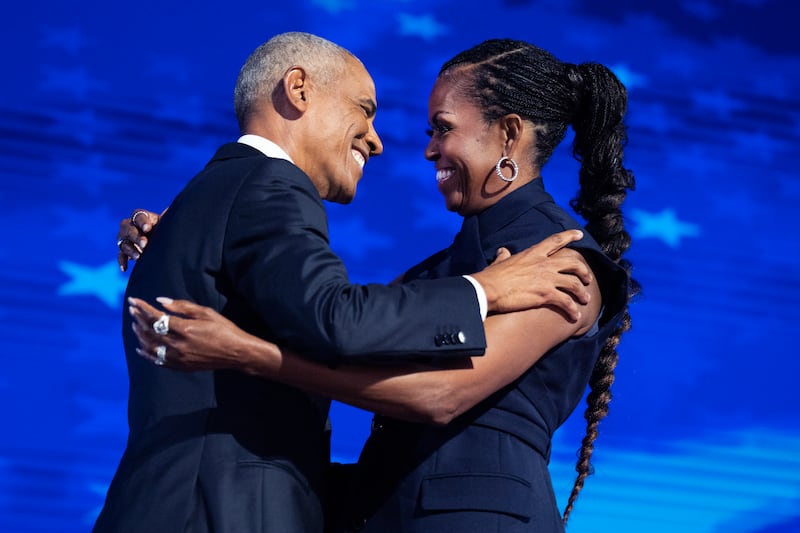 UNITED STATES - AUGUST 20: Former President Barack Obama and former first lady Michelle Obama appear on stage in between their addresses on the second night of the Democratic National Convention at the United Center in Chicago, Ill., on Tuesday, August 20, 2024. (Tom Williams/CQ-Roll Call, Inc via Getty Images)
