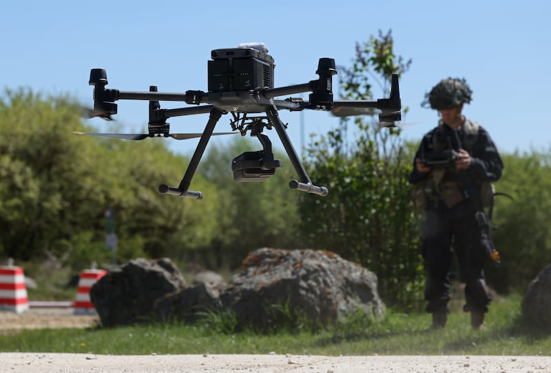 A member of the U.S. Army 7th Army Training Command, clad in black in the role of opposition force, pilots a DJI Matrice drone during the "Combined Resolve" military exercise at the 7th ATC Joint Multinational Readiness Center on April 30, 2026 in Hohenfels, Germany.