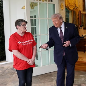 Trump tips Sharon Simmons after receiving a DoorDash delivery of McDonald's during the press conference. Photo by Win McNamee/Getty Images.