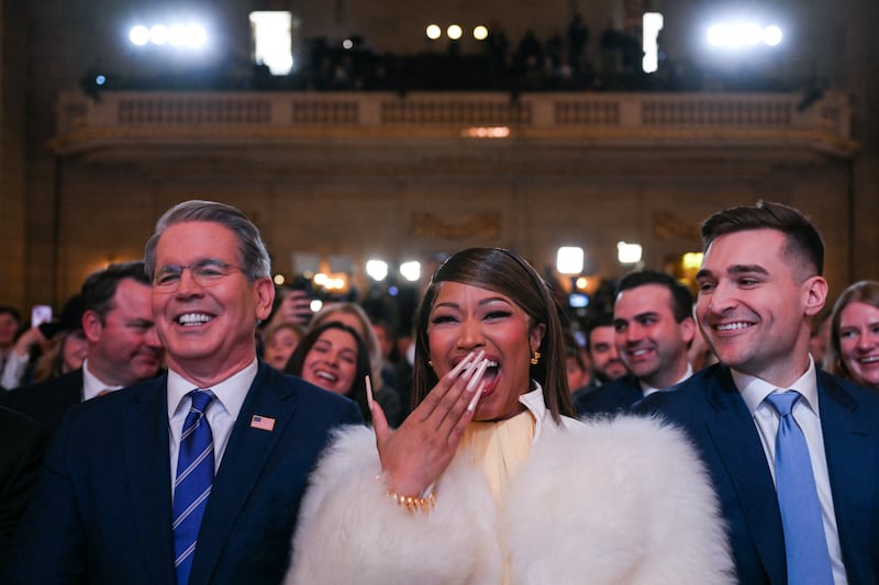 U.S. Secretary of Treasury Scott Bessent and Trinidadian rapper and singer-songwriter Nicki Minaj listen as US President Donald Trump delivers remarks on 'Trump Accounts' at the Andrew W. Mellon Auditorium in Washington, DC, on January 28, 2026.
