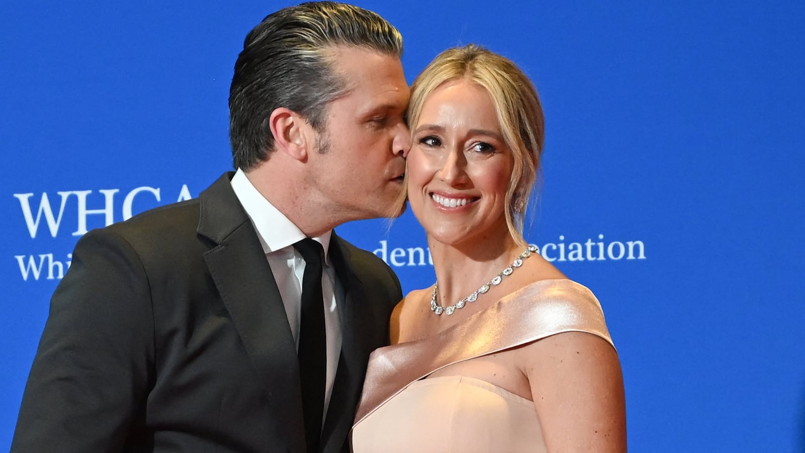 US Secretary of Defense Pete Hegseth (L) and wife Jennifer Rauchet attend the White House Correspondents' dinner at the Washington Hilton in Washington, DC, on April 25, 2026. US President Donald Trump is attending the annual gala of the political press for the first time while in office. (Photo by Alex WROBLEWSKI / AFP via Getty Images)