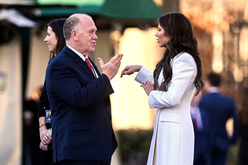 Secretary of Homeland Security Kristi Noem (R) and White House 'border czar' Tom Homan speak on the grounds of the White House in Washington, DC, on January 29, 2025. (Photo by ROBERTO SCHMIDT / AFP) (Photo by ROBERTO SCHMIDT/AFP via Getty Images)
