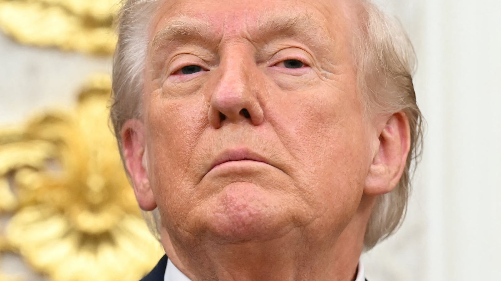 US President Donald Trump looks on during the announcement of a deal to lower drug prices with drug maker AstraZeneca at the Oval Office of the White House in Washington, DC, on October 10, 2025. (Photo by SAUL LOEB / AFP)