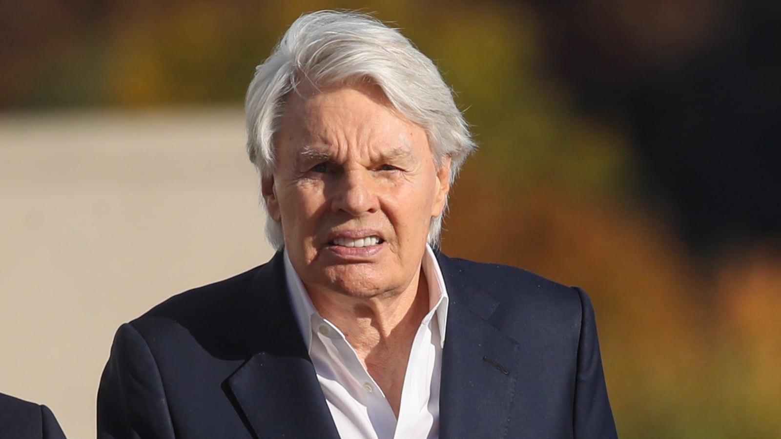 Former Abercrombie & Fitch CEO Mike Jeffries leaves a Long Island court with members of his legal team