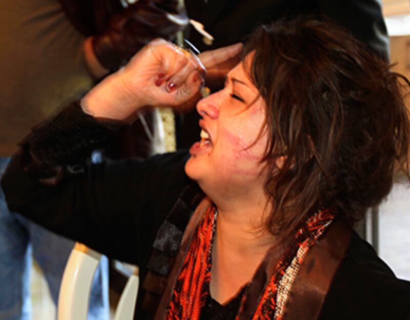 articles/2011/03/27/eman-al-obeidis-rape-accusations-against-gaddafis-regime/griswold-eman-al-obeidi_169537_yiio0j