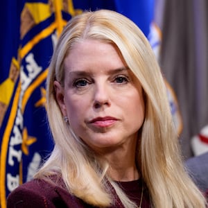 Attorney General Pam Bondi and FBI Director Kash Patel (R) appear during a news conference