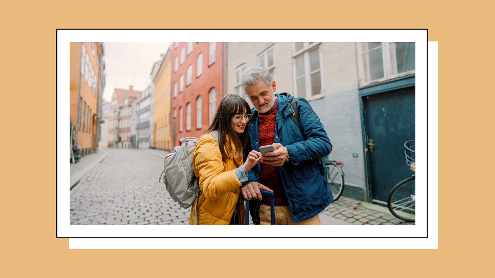 Travelers using the Babbel language learning app on a smartphone while exploring a European city.