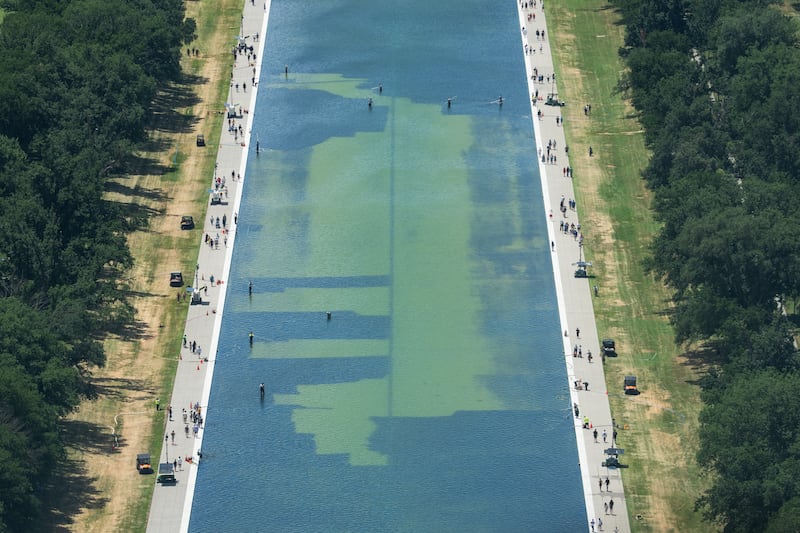 In an aerial view from the Washington Monument, crews remove algae from the bottom of the Lincoln Memorial Reflecting Pool after recent renovations following a directive from U.S. President Donald Trump to paint it blue ahead of the 250th anniversary of U.S. independence, in Washington, D.C., U.S., June 19, 2026. REUTERS/Aaron Schwartz