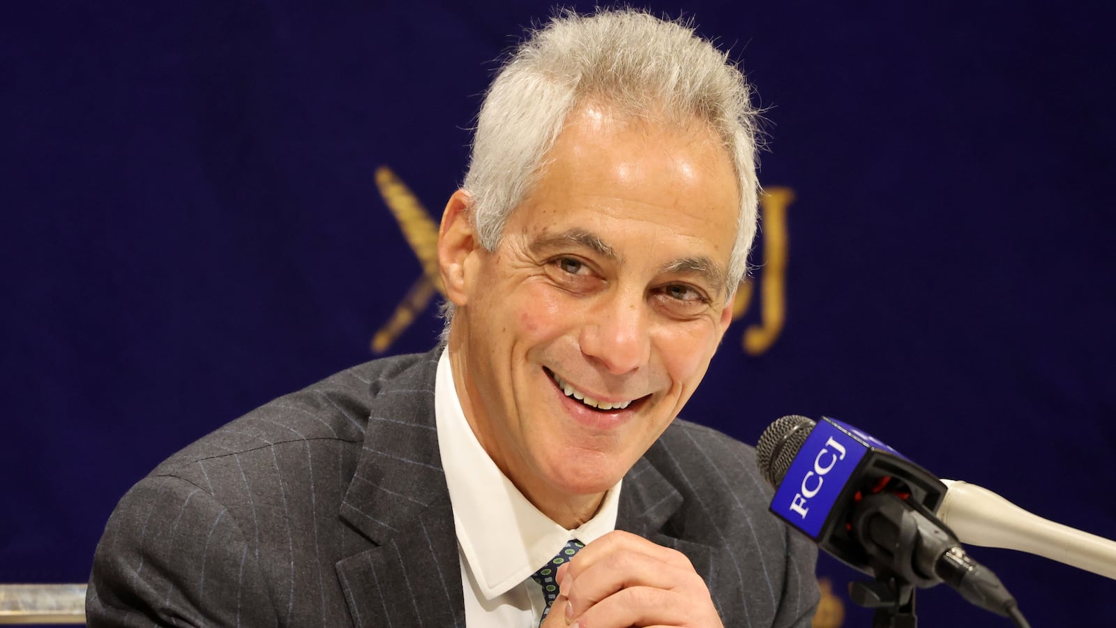 Rahm Emanuel smiles during a speech in Japan, where he was serving as ambassador, in 2022.