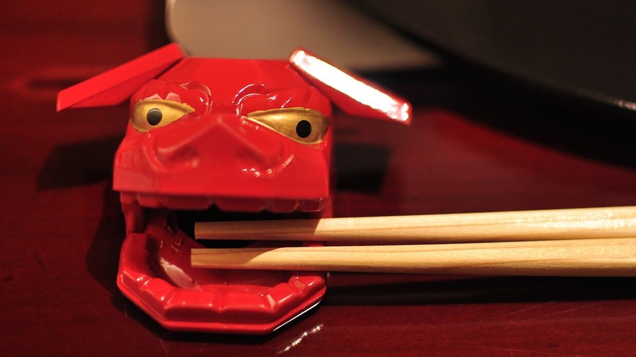 Chopsticks on a rest.