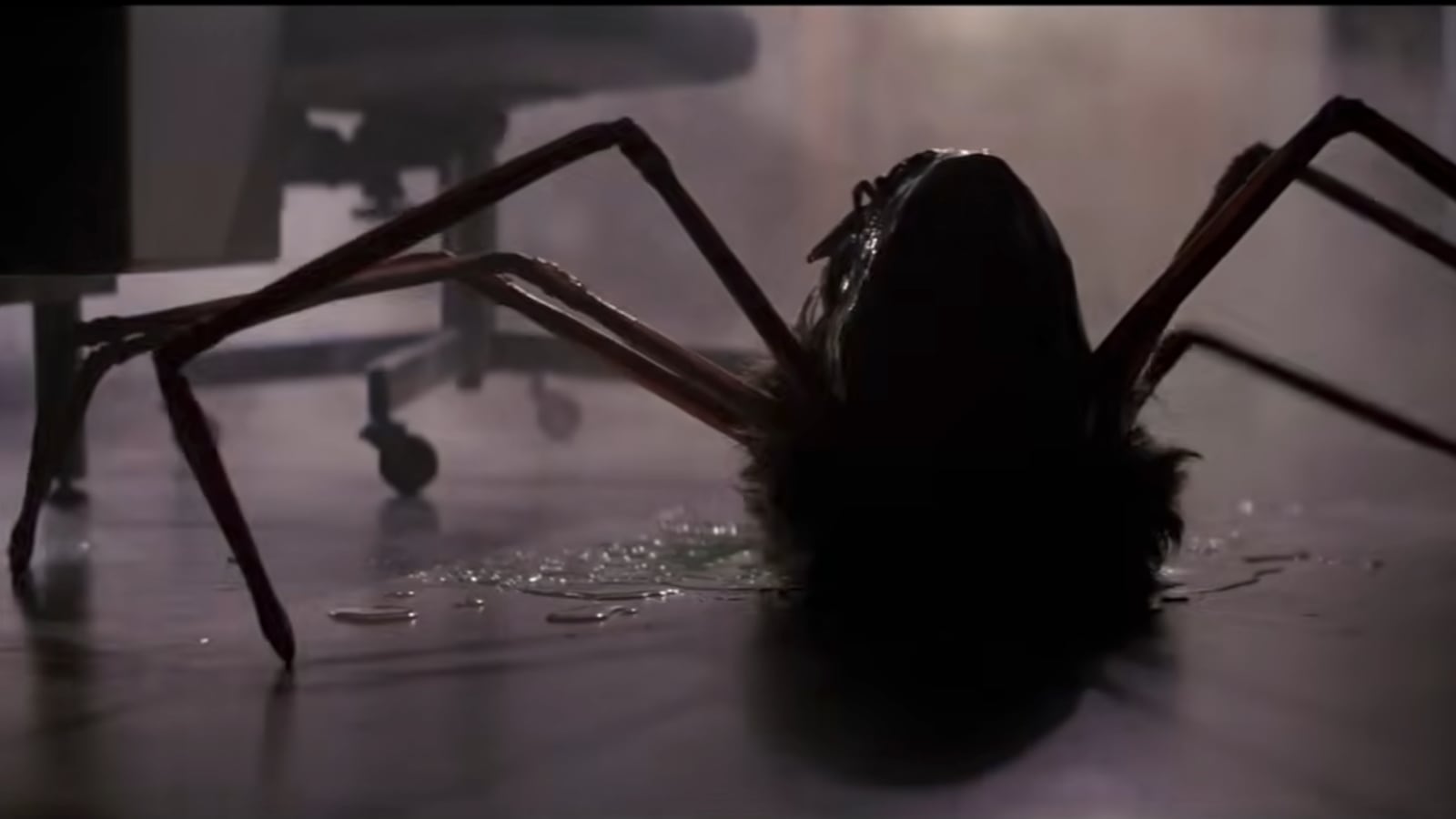 A still from the horror classic The Thing (1982) shows a human head with spider-like legs.