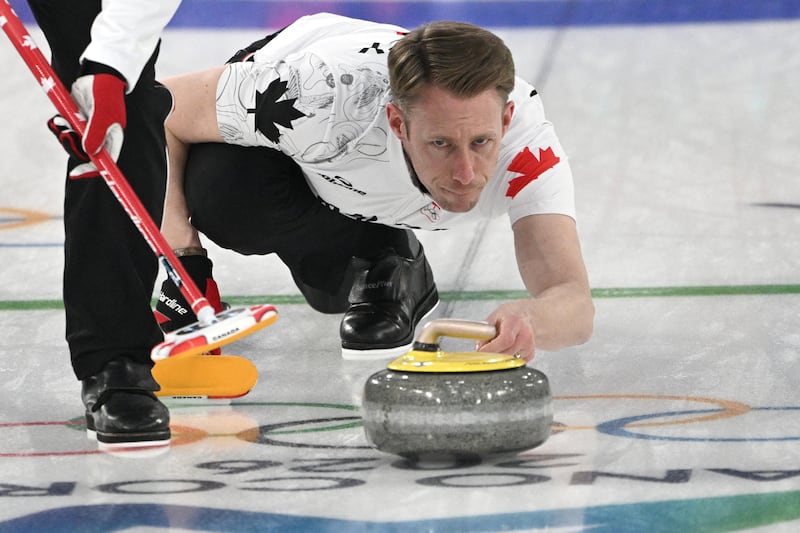 Canada's Marc Kennedy competes in the curling men's round robin between Switzerland and Canada during the Milano Cortina 2026 Winter Olympic Games at the Cortina Curling Olympic Stadium in Cortina d'Ampezzo on February 14, 2026. (Photo by Tiziana FABI / AFP via Getty Images)