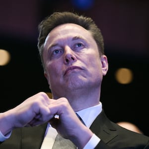 Elon Musk looks on as US President Donald Trump speaks at the US-Saudi Investment Forum at the John F. Kennedy Center for the Performing Arts in Washington, DC on November 19, 2025. (Photo by Brendan SMIALOWSKI / AFP) (Photo by BRENDAN SMIALOWSKI/AFP via Getty Images)