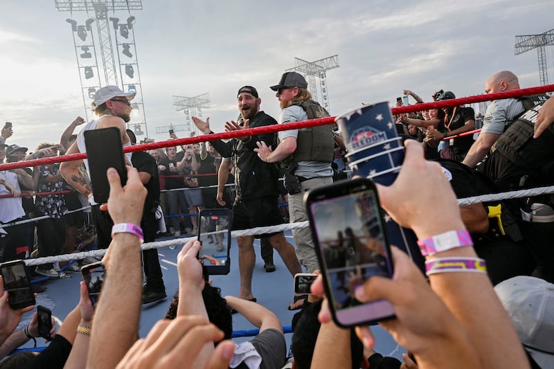 UFC Middleweight Champion Sean Strickland reacts as he is lead away by a U.S. Marshal, at the UFC Fan Fest on the Ellipse near the White House, on the day of UFC Freedom 250, in Washington, D.C., U.S., June 14, 2026. REUTERS/Matt McClain REFILE - QUALITY REPEAT     TPX IMAGES OF THE DAY