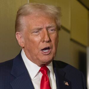 US President Donald Trump speaks to the media aboard Air Force One as he returns to the United States on October 30, 2025. (Photo by ANDREW CABALLERO-REYNOLDS / AFP) (Photo by ANDREW CABALLERO-REYNOLDS/AFP via Getty Images)