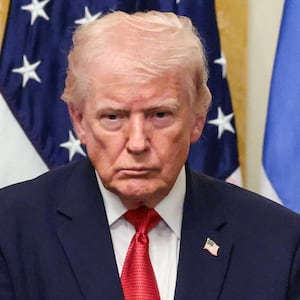 U.S. President Donald Trump, Archbishop Elpidophoros, Primate of the Greek Orthodox Archdiocese of America and U.S. Ambassador to Greece Kimberly Ann Guilfoyle attend a celebration in honor of Greek Independence Day in the East Room of the White House in Washington, D.C., U.S., March 26, 2026.