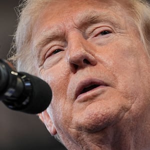 U.S. President Donald Trump delivers remarks at David S. Mack Center for Training and Intelligence in Garden City, New York, U.S., August 14, 2026. REUTERS/Ken Cedeno