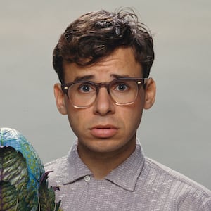 Canadian actor Rick Moranis with the plant Audrey II of the film Little Shop of Horrors, directed by Frank Oz and released in 1986.