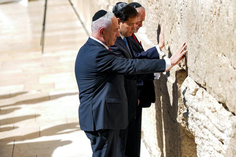 Netanyahu, Rubio, and US ambassador to Israel Mike Huckabee visit the Western Wall, Judaism's holiest prayer site, in the old city of Jerusalem.