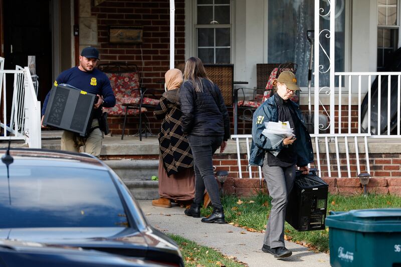 Members of the FBI remove items from a home in Dearborn, Michigan, on October 31, 2025.