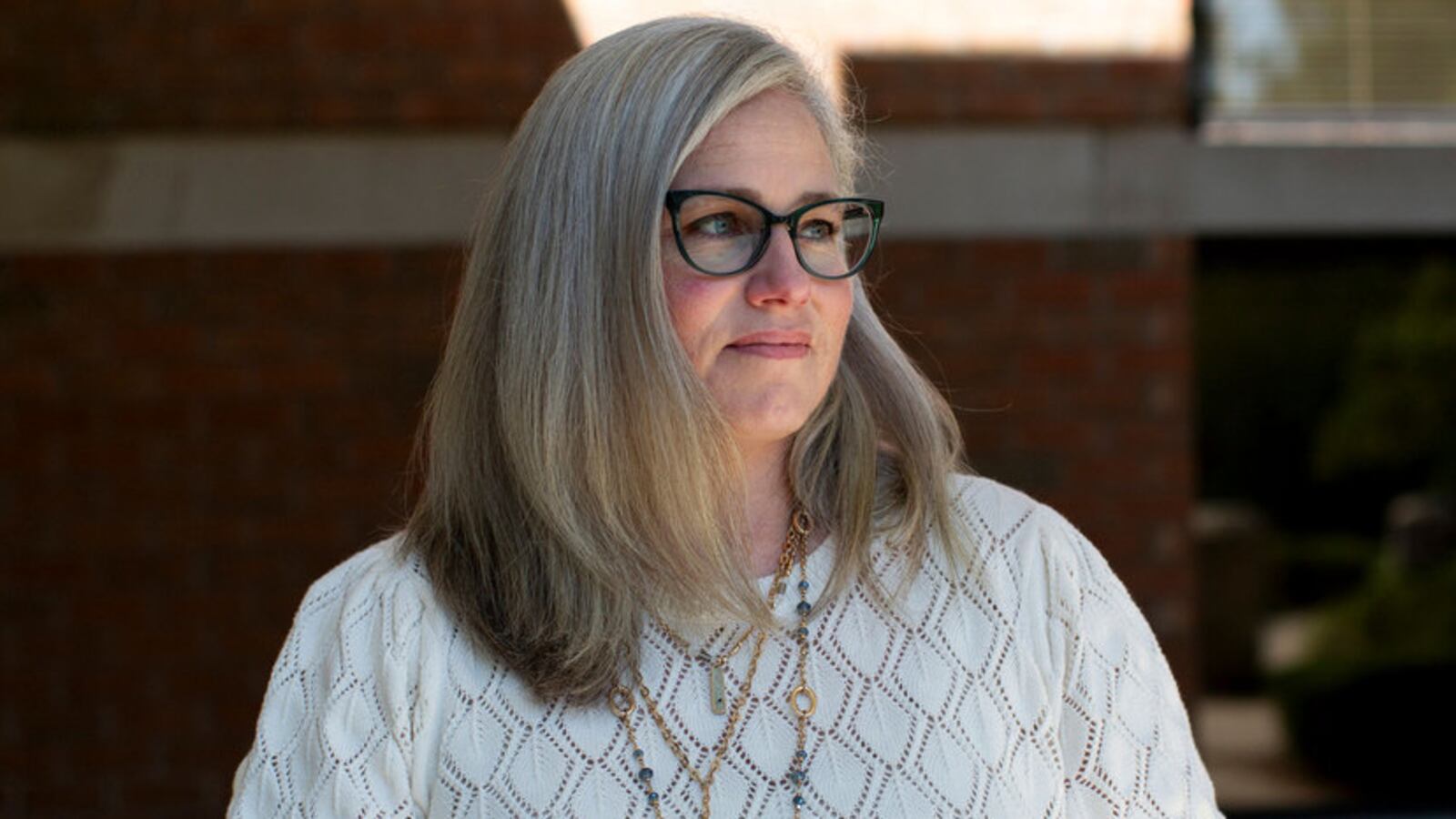 Adeline Hambley poses for a portrait outside of a building in Ottawa County