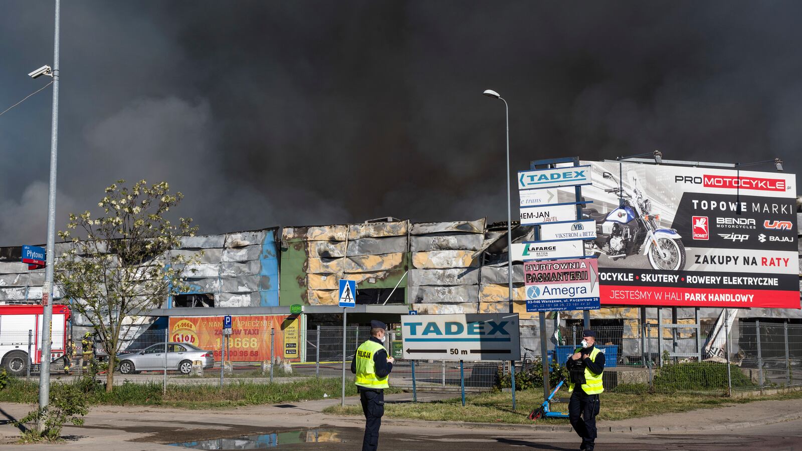 Black smoke seen in the sky above the burning Marywilska 44 shopping center in Warsaw.