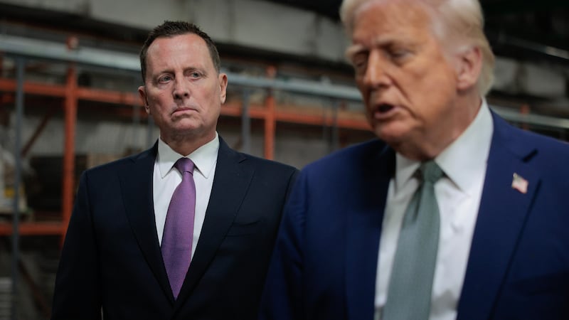 U.S. President Donald Trump speaks to the media alongside Richard Grenell.