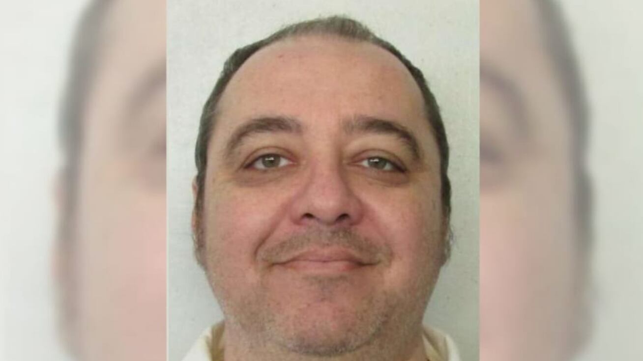 Kenneth Smith stares forward in an undated booking photo.