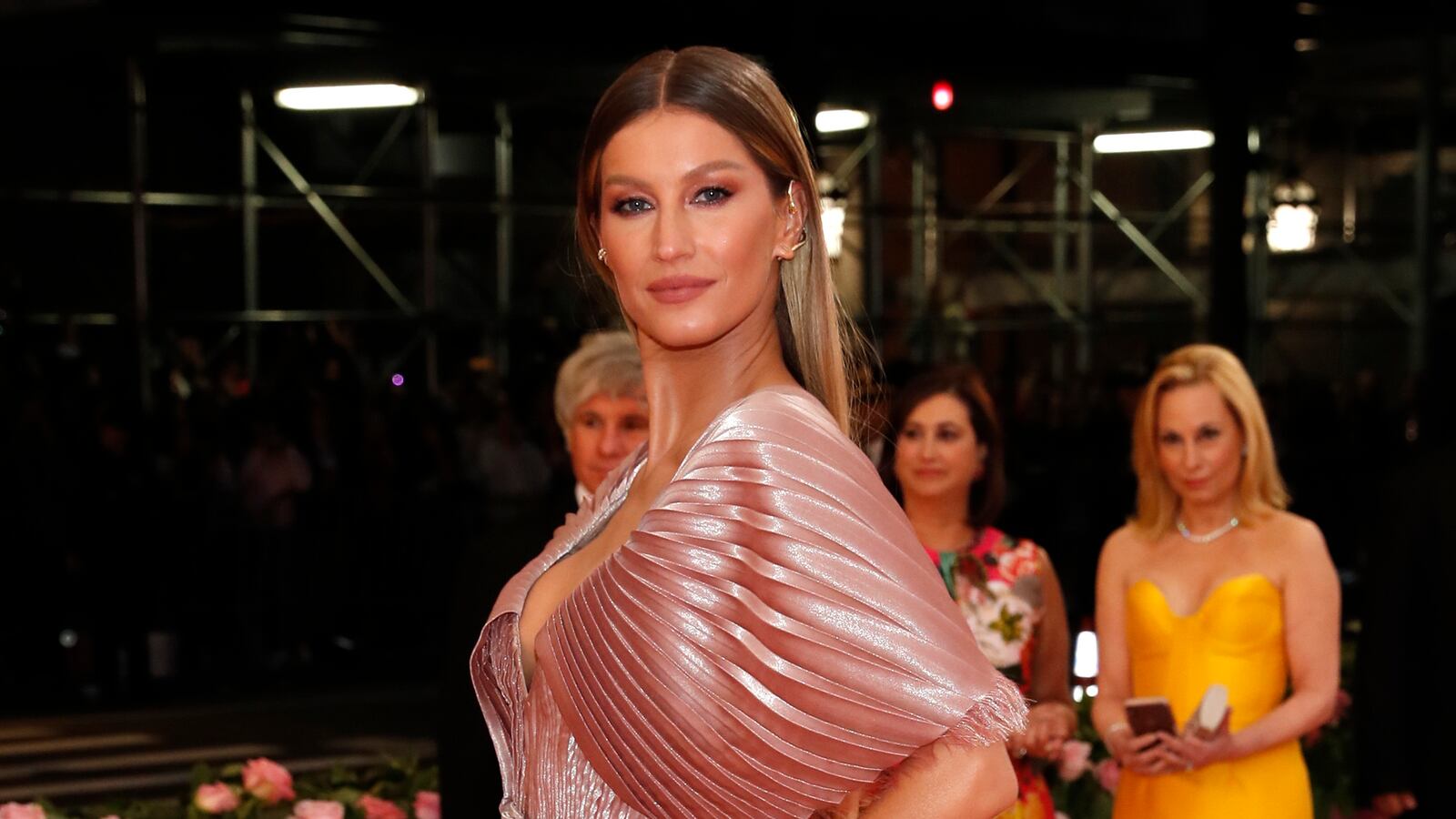 Gisele Bundchen poses on the Met Gala red carpet