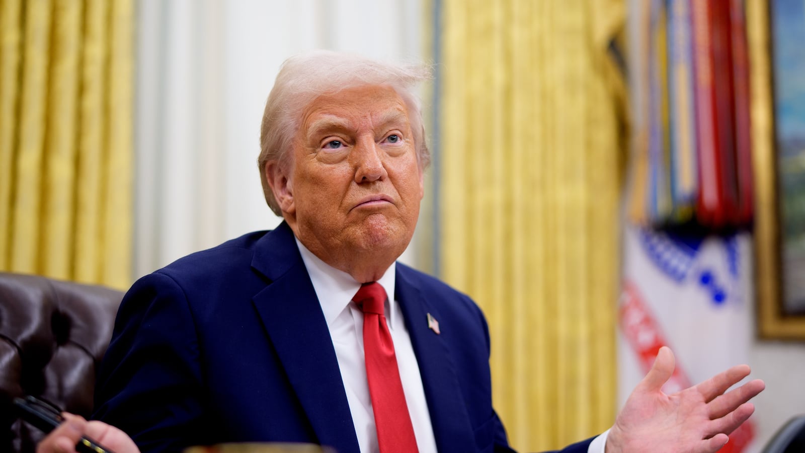 WASHINGTON, DC - MARCH 31: U.S. President Donald Trump gestures while speaking during an executive order signing event in the Oval Office of the White House on March 31, 2025 in Washington, DC. Trump has signed an executive order against ticket scalping and reforming the live entertainment ticket industry. (Photo by Andrew Harnik/Getty Images)