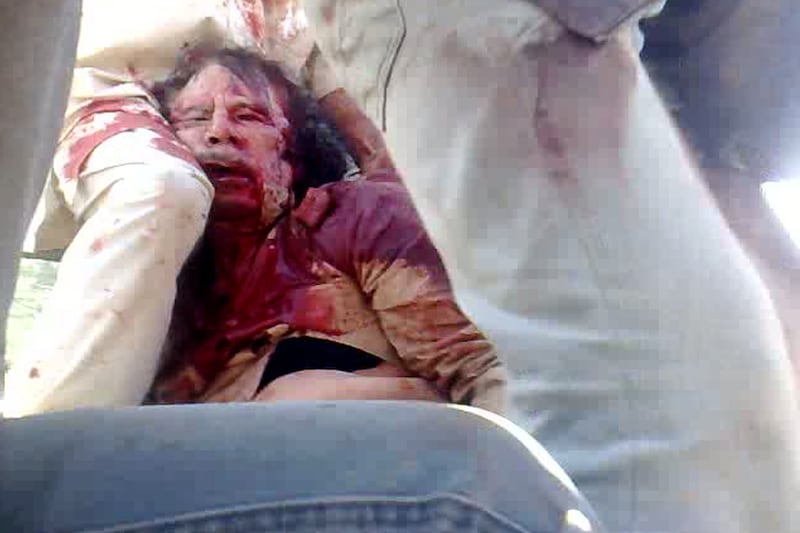 articles/2011/10/23/libya-declares-freedom-after-gaddafi-s-death-photos/gaddafi-death-photo_gen8ea