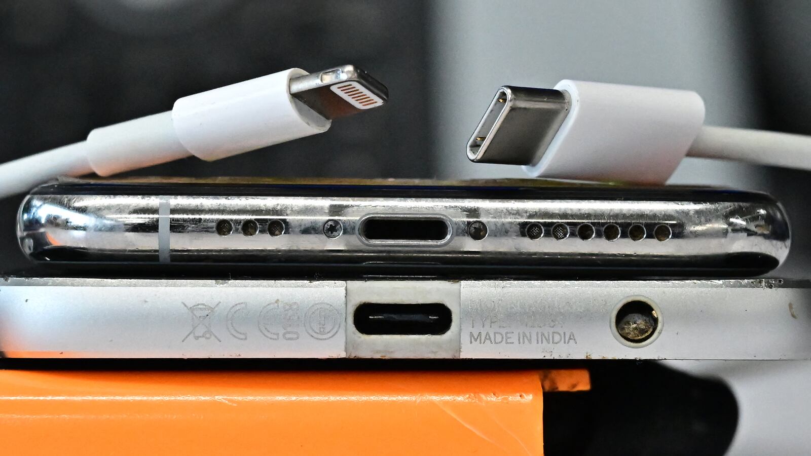 A USB-C charger (R) and a traditional Apple Lightning charger