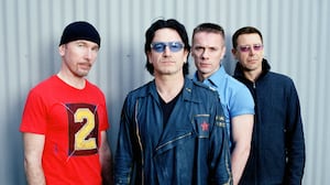The Edge, Bono, Larry Mullen Jr., and Adam Clayton of U2 pose in a portrait on April 7, 2001, in Los Angeles.