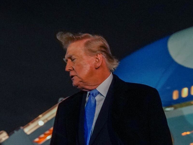 US President Donald Trump speaks to reporters after exiting Air Force One as he returns from Medinah, Illinois, at Joint Base Andrews, Maryland, US, September 27, 2026. REUTERS/Nathan Howard