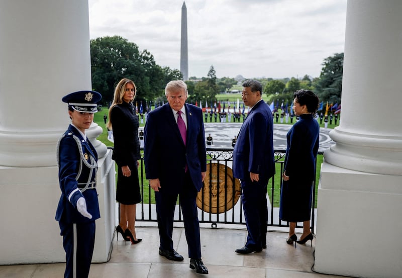 President Donald Trump, first lady Melania Trump, Chinese President Xi Jinping and his wife Peng Liyuan leave after watching a military demonstration from a balcony of the White House in Washington, D.C., September 24, 2026.