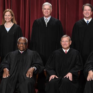 Justices of the US Supreme Court pose for their official photo at the Supreme Court in Washington, DC on October 7, 2022. (Seated from left) Associate Justice Sonia Sotomayor, Associate Justice Clarence Thomas, Chief Justice John Roberts, Associate Justice Samuel Alito and Associate Justice Elena Kagan, (Standing behind from left) Associate Justice Amy Coney Barrett, Associate Justice Neil Gorsuch, Associate Justice Brett Kavanaugh and Associate Justice Ketanji Brown Jackson. (Photo by OLIVIER DOULIERY / AFP) (Photo by OLIVIER DOULIERY/AFP via Getty Images)
