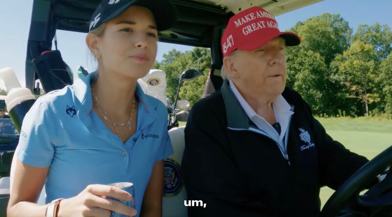 Donald Trump plays golf with his granddaughter Kai Trump.