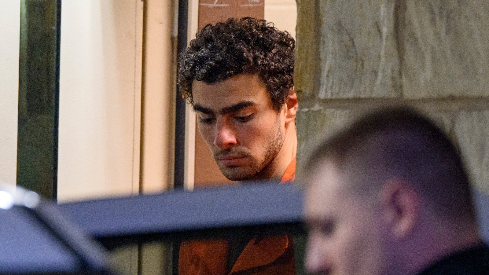 Suspected shooter Luigi Mangione is led from the Blair County Courthouse after an extradition hearing December 10, 2024 in Hollidaysburg, Pennsylvania.
